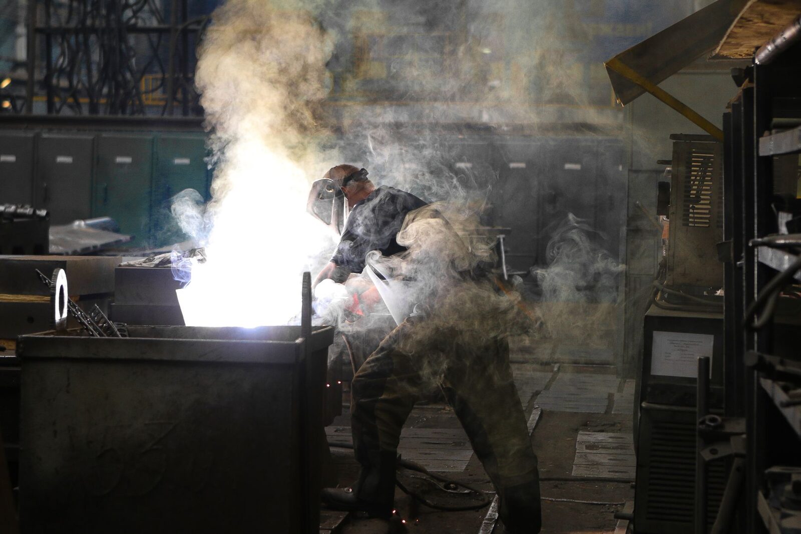 Farmworkers in protective gear laboring during hot conditions