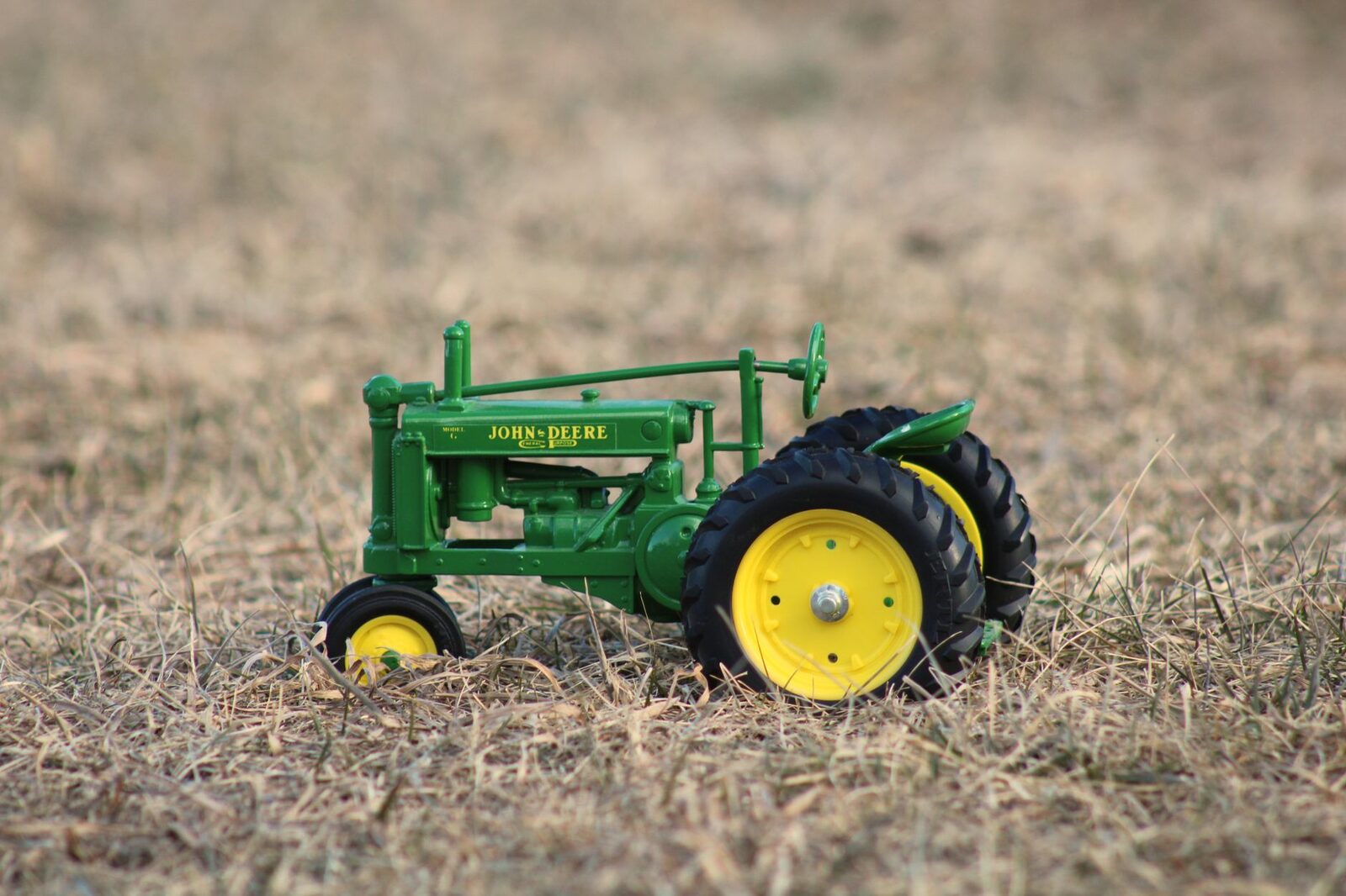Green and yellow John Deere tractor in a field