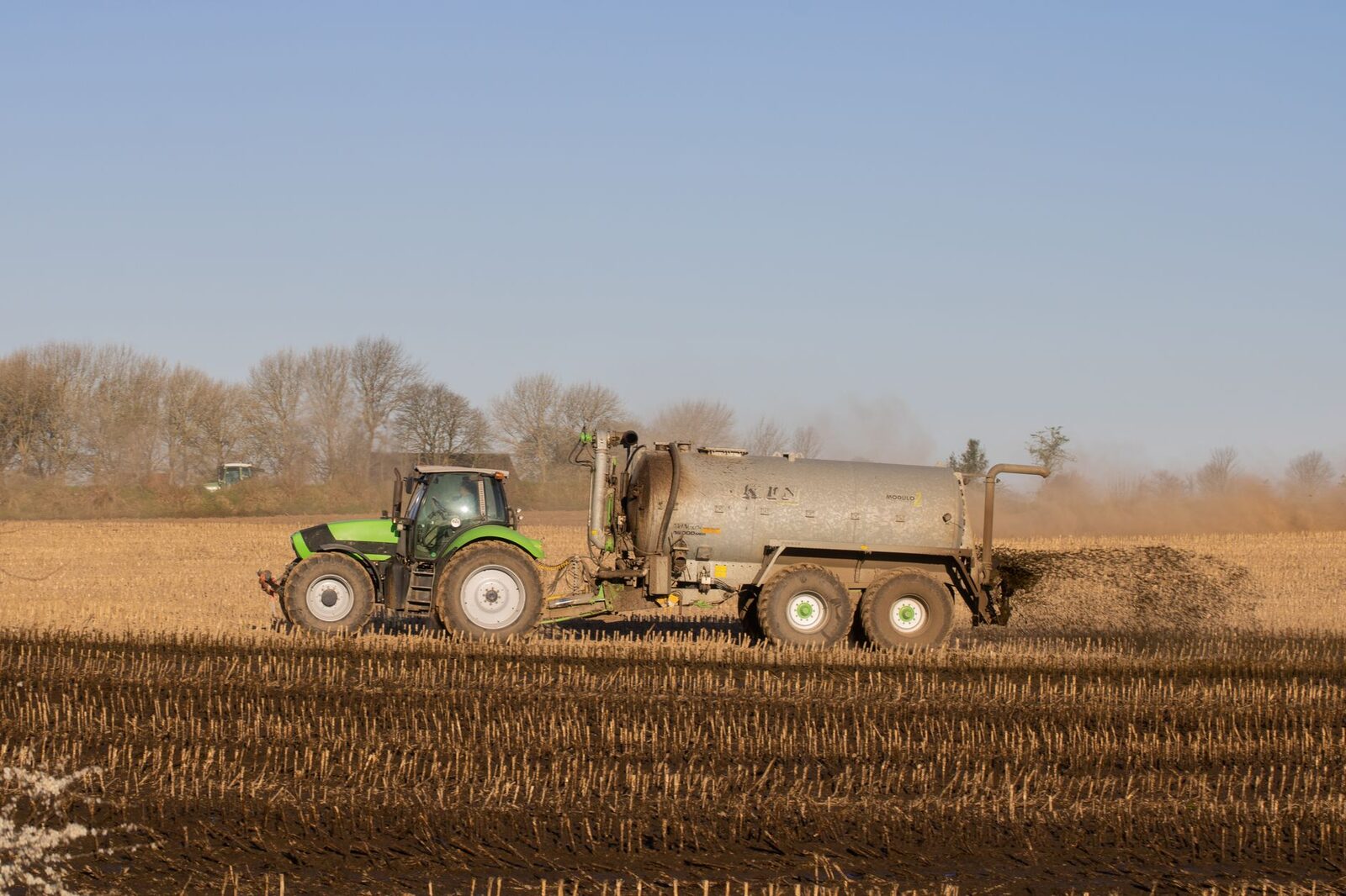 Bags of fertilizer stacked in a field